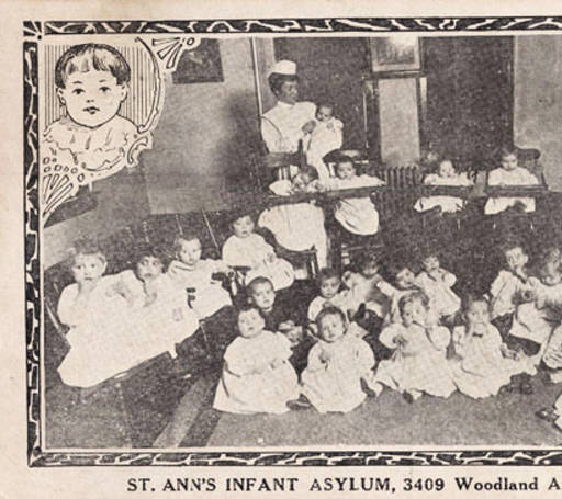 A group of 20 infants with nurse circa 1910.    